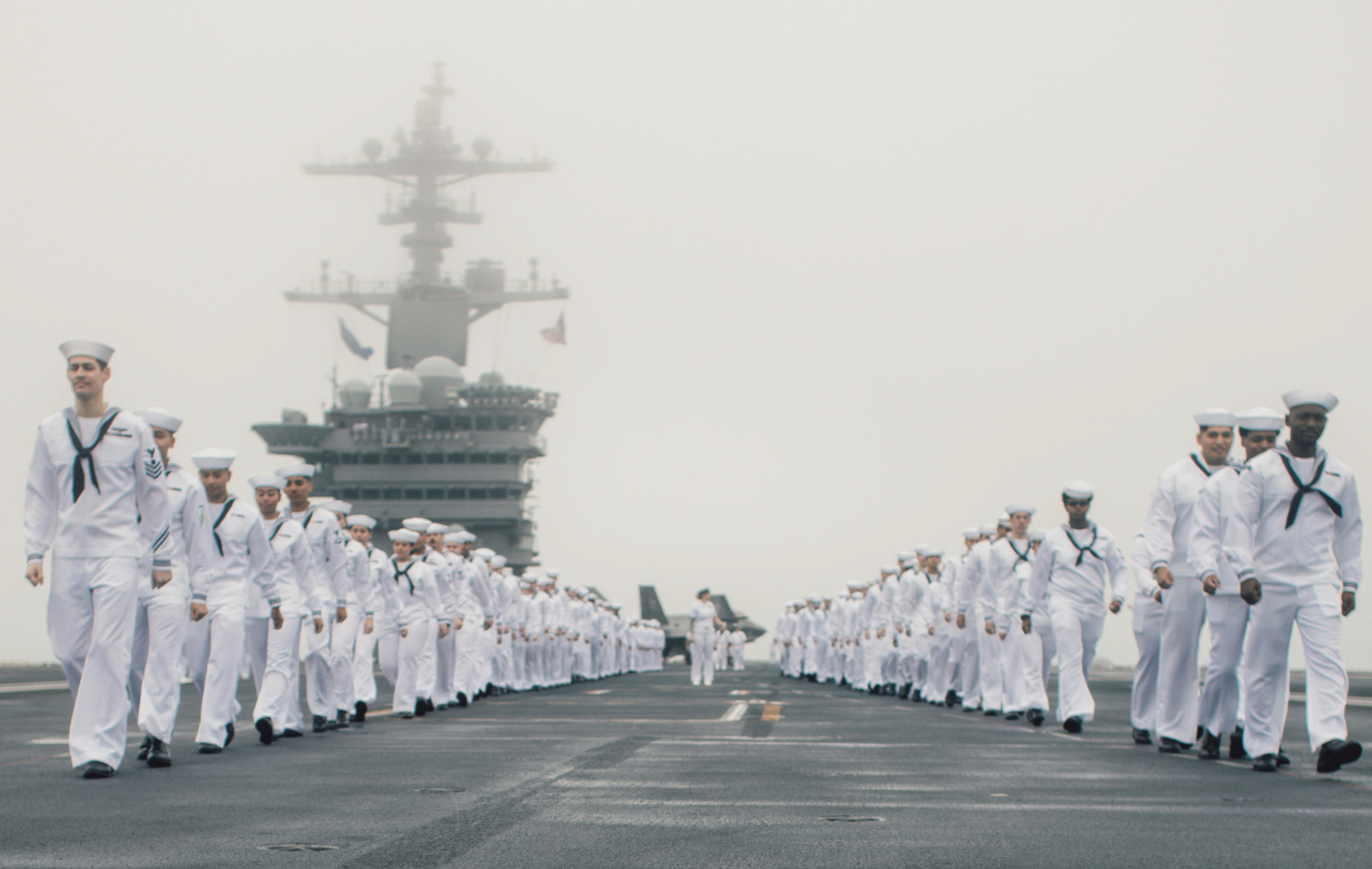 Sailors man rails on flight deck of USS George Washington while underway in Pacific Ocean, July 10, 2024 (U.S. Navy/Julianna J. Lynch)